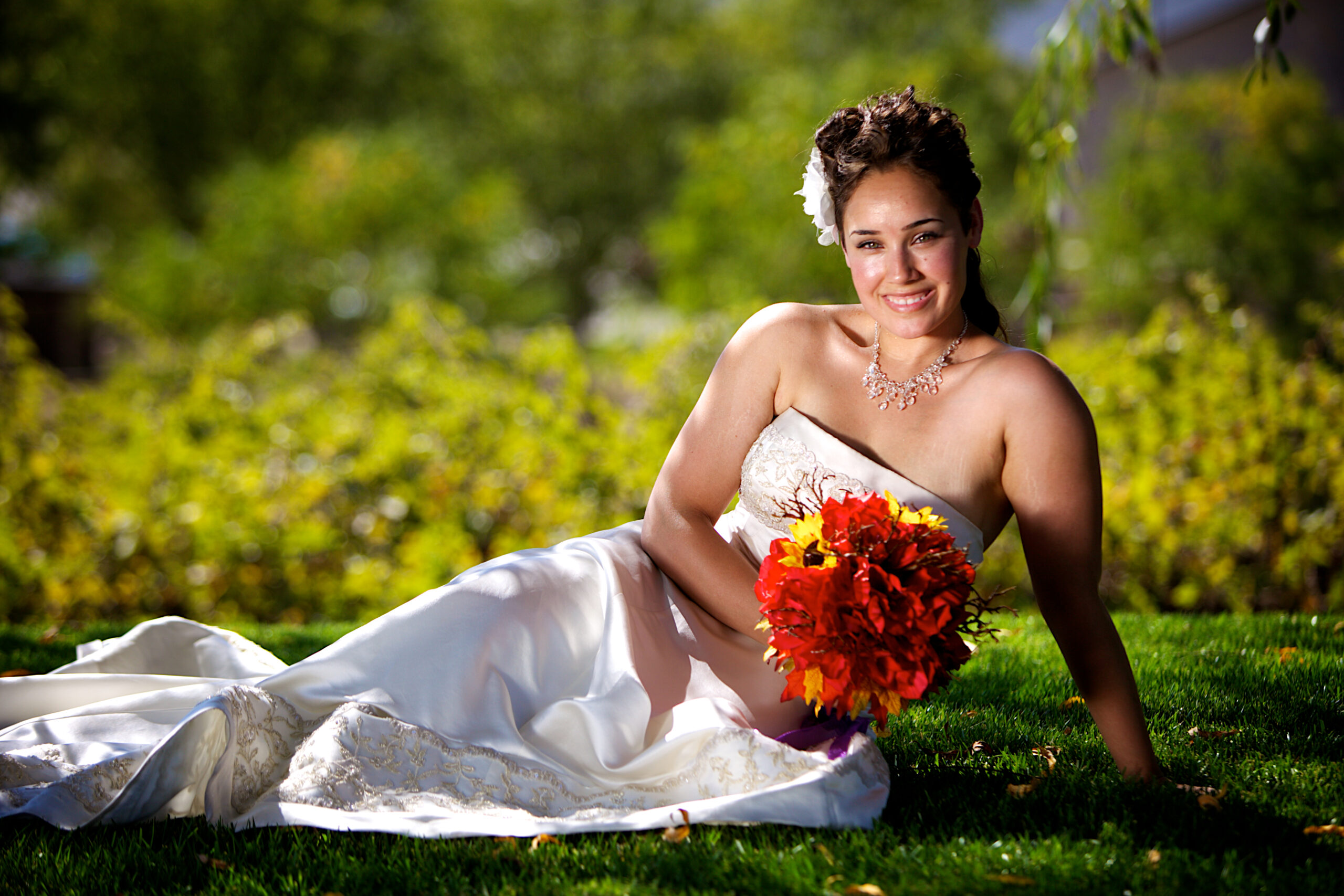 Wedding portfolio banner with bride lying on grass
